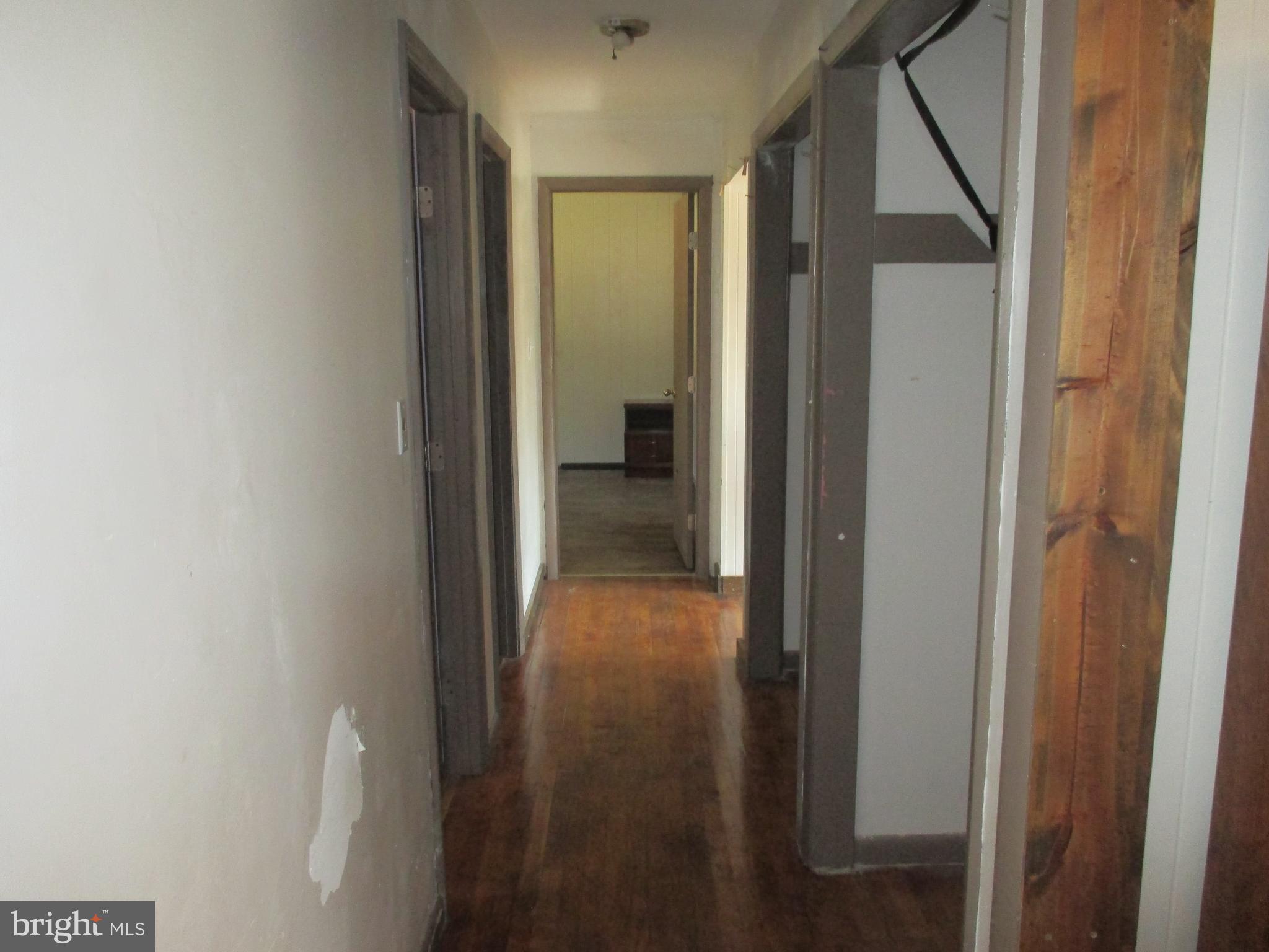 11198 Knobley Road Keyser, WV 26726 - Photo 18 of 24 a view of a hallway with wooden floor and entryway