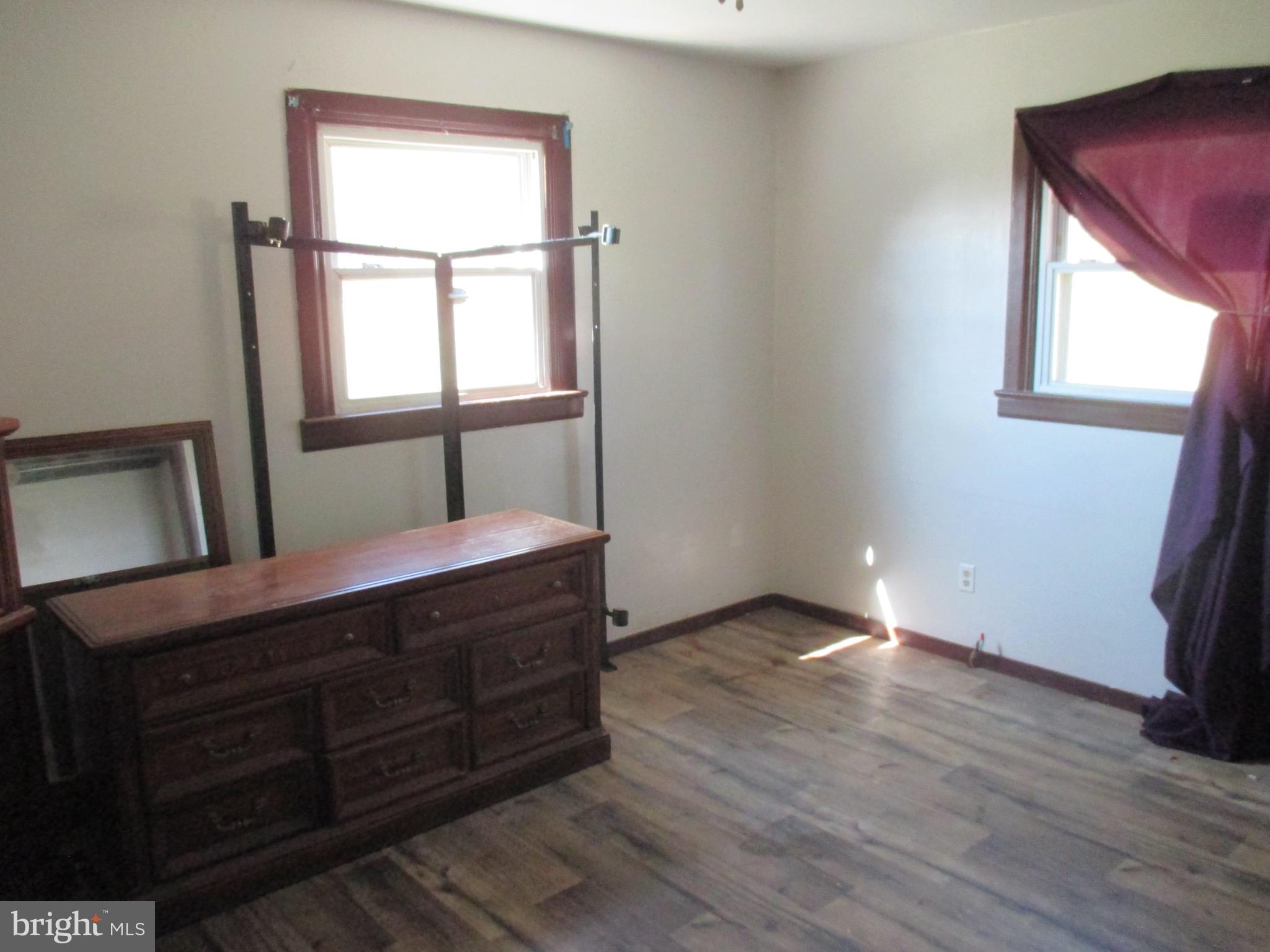 11198 Knobley Road Keyser, WV 26726 - Photo 19 of 24 a room with a bed and a mirror
