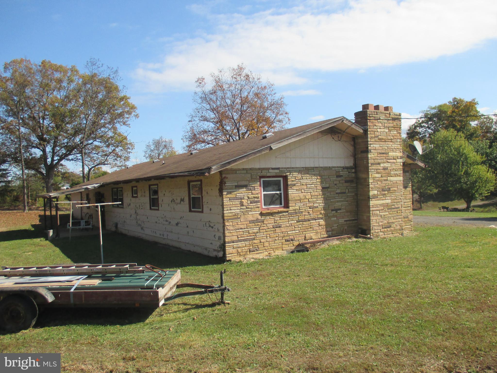 11198 Knobley Road Keyser, WV 26726 - Photo 5 of 24 a view of a house with a back yard