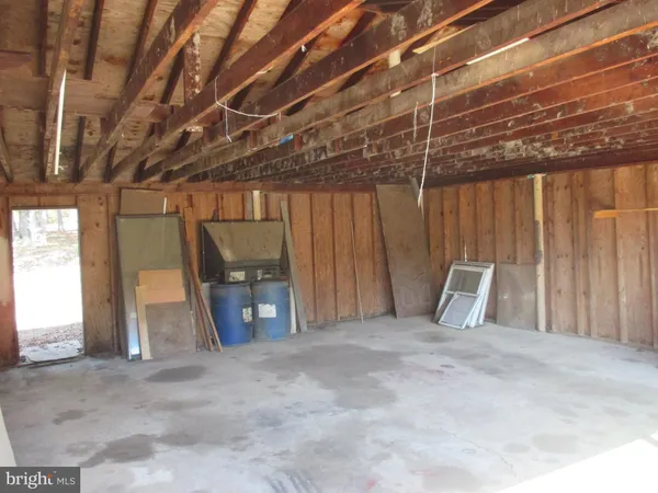 a view of a room with wooden walls
