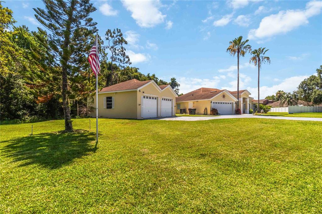 3225 Canoe Creek Road St. Cloud, FL 34772 - Photo 3 of 30 a house view with swimming pool and palm tree