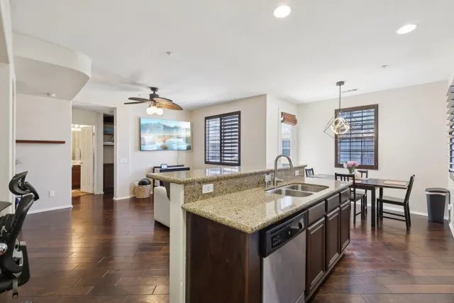 a kitchen with center island table and chairs in it