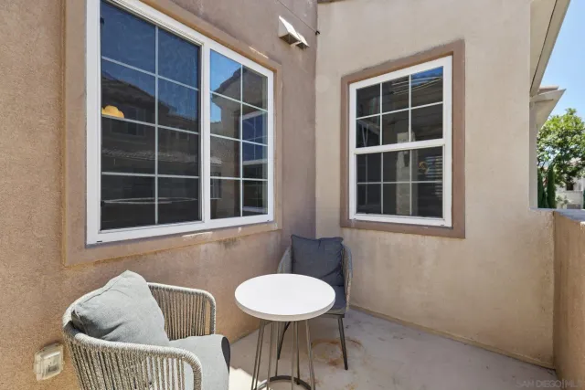 a front view of a house with a lounge chair