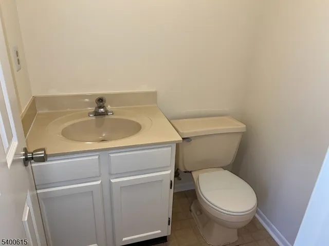 a bathroom with a toilet and a sink