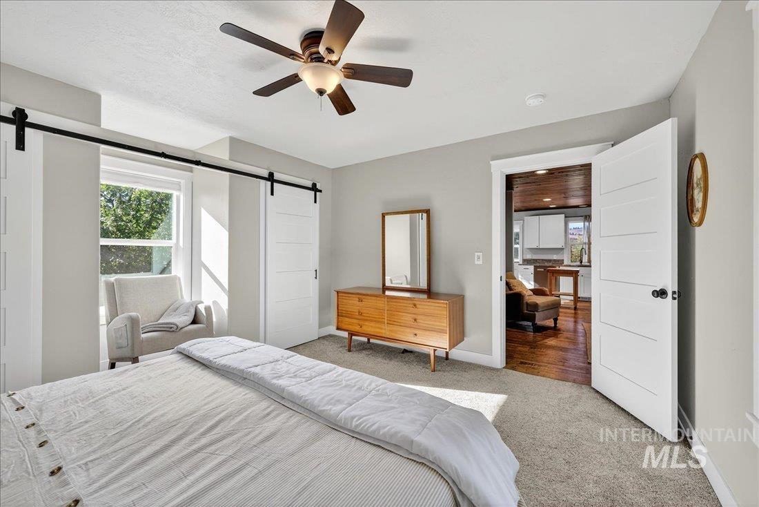 2651 Fruitvale Glendale Road Council, ID 83612 - Photo 14 of 24 Carpeted interior with light gray walls and a ceiling fan with integrated lighting
