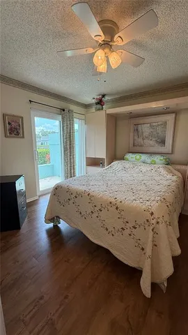 a view of a hallway to a house with wooden floor and stairs