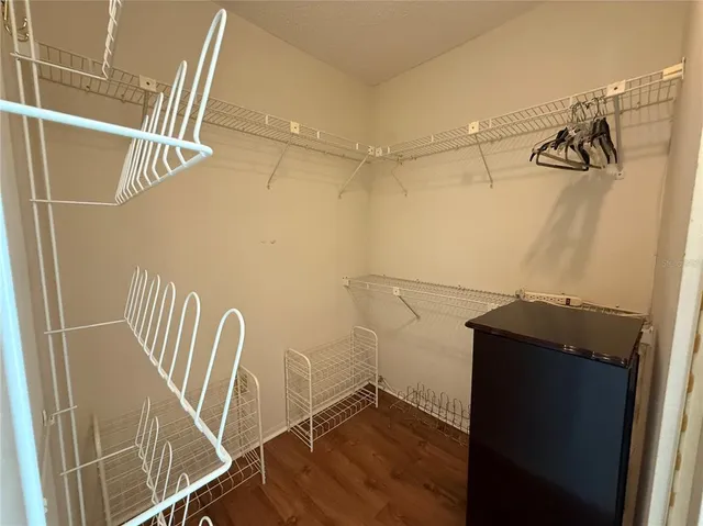 a bedroom with a bed and balcony view