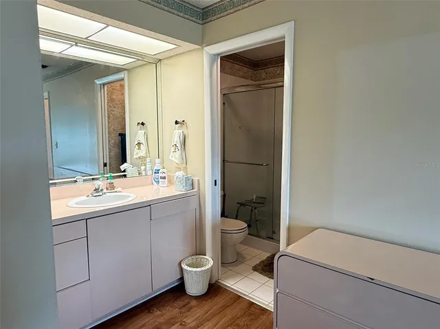 a bathroom with a glass shower door