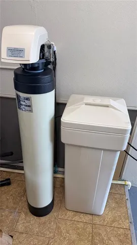 a view of a garden with lawn chairs