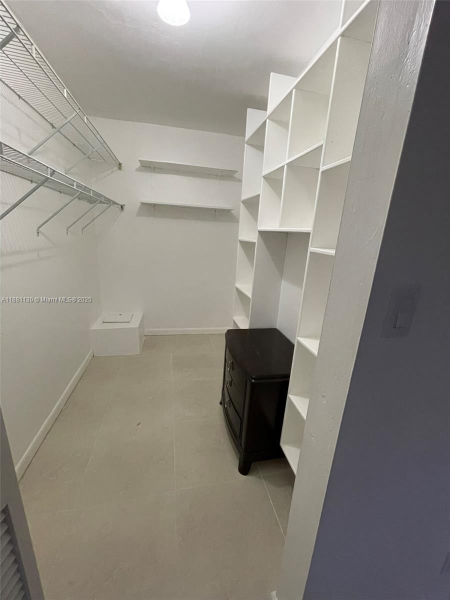 2718 South University Drive, Unit 17C Davie, FL 33328 - Photo 13 of 26 2nd bedroom walk-in closet