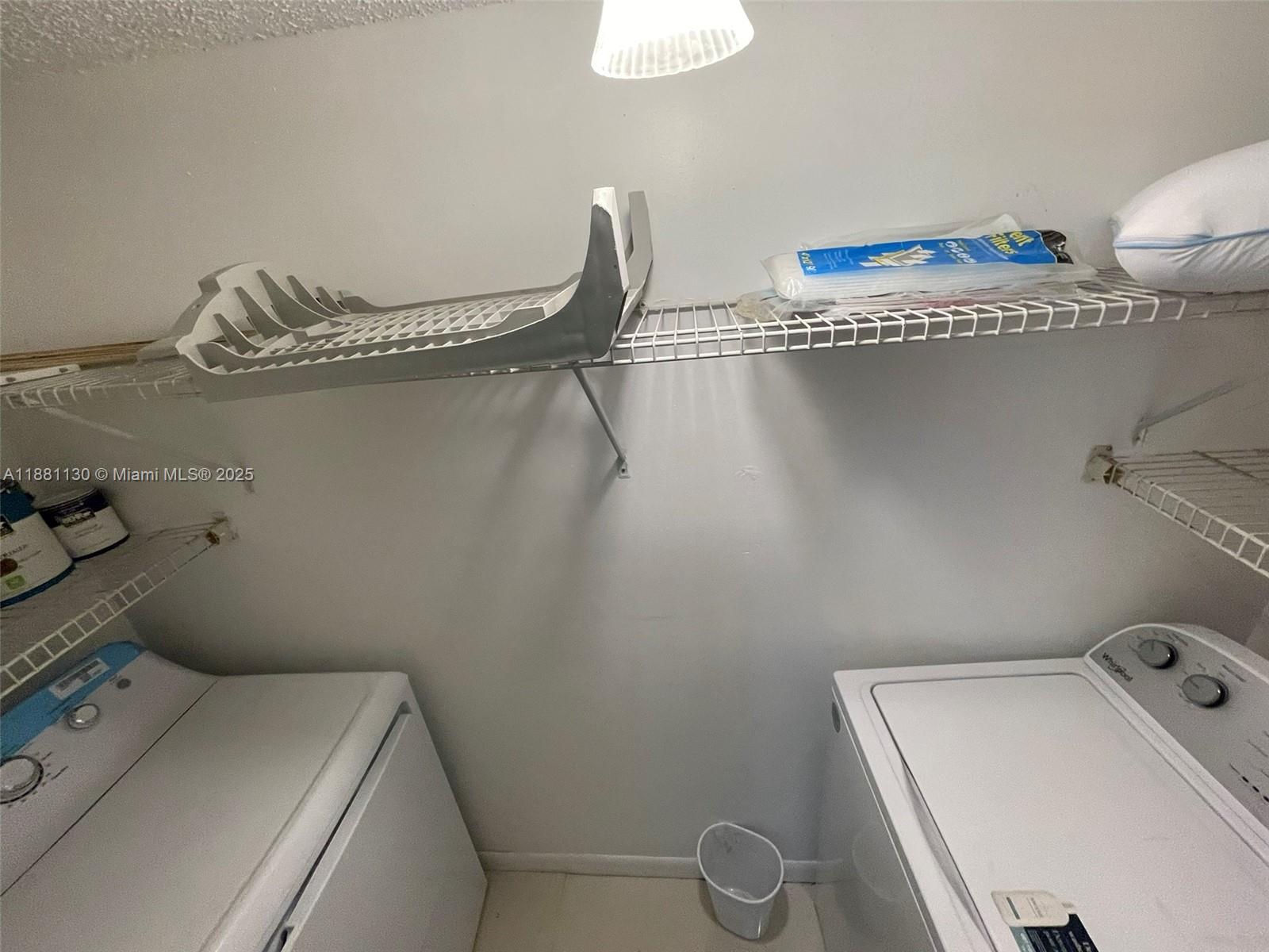 2718 South University Drive, Unit 17C Davie, FL 33328 - Photo 5 of 26 Full size washer and dryer in laundry closet.