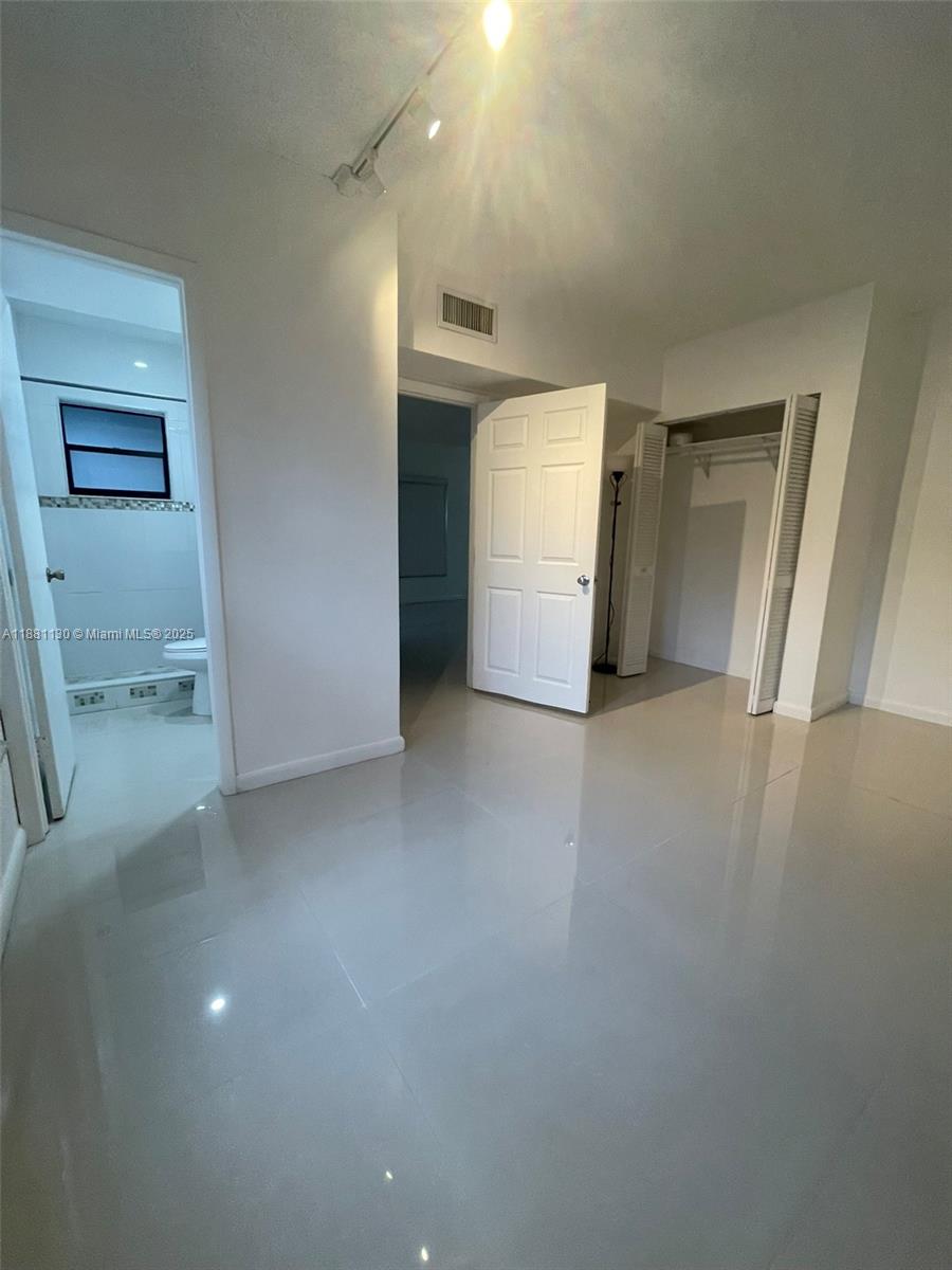 2718 South University Drive, Unit 17C Davie, FL 33328 - Photo 7 of 26 Downstairs Full Bedroom and Bathroom