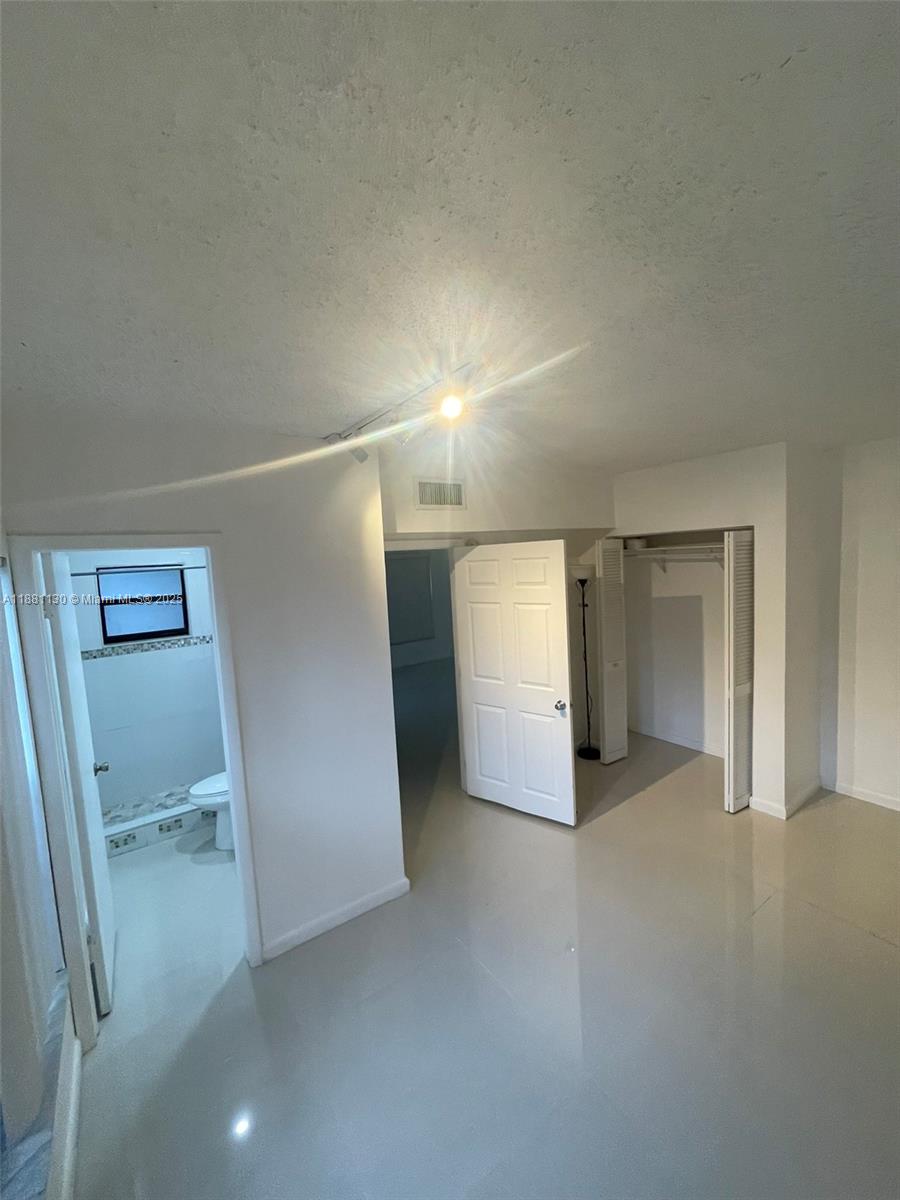 2718 South University Drive, Unit 17C Davie, FL 33328 - Photo 8 of 26 Downstairs Full Bedroom and Bathroom