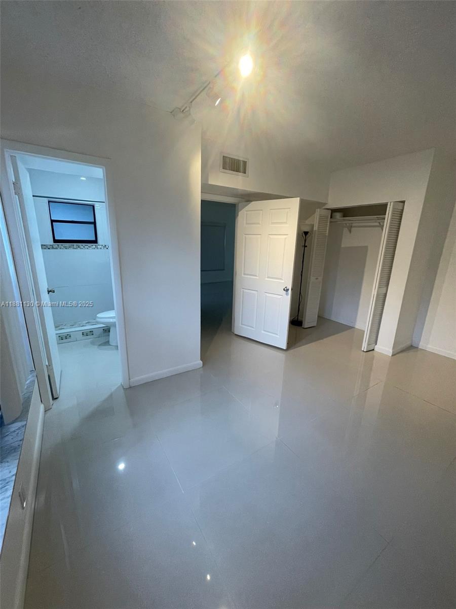 2718 South University Drive, Unit 17C Davie, FL 33328 - Photo 9 of 26 Downstairs Full Bedroom and Bathroom