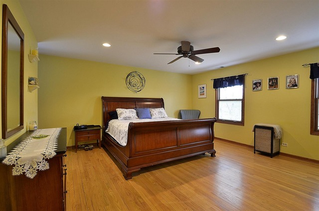 1616 South Tyler Road St. Charles, IL 60174 - Photo 11 of 25 a bedroom with a bed and wooden floor