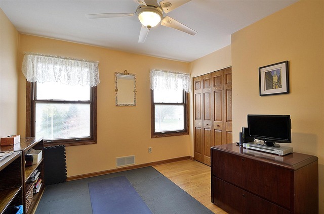 1616 South Tyler Road St. Charles, IL 60174 - Photo 16 of 25 a view of workspace with wooden floor outdoor space window and flat screen tv