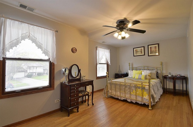 1616 South Tyler Road St. Charles, IL 60174 - Photo 17 of 25 a bedroom with a bed and a chandelier