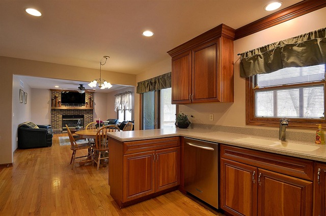 1616 South Tyler Road St. Charles, IL 60174 - Photo 7 of 25 a kitchen with a sink stove and cabinets