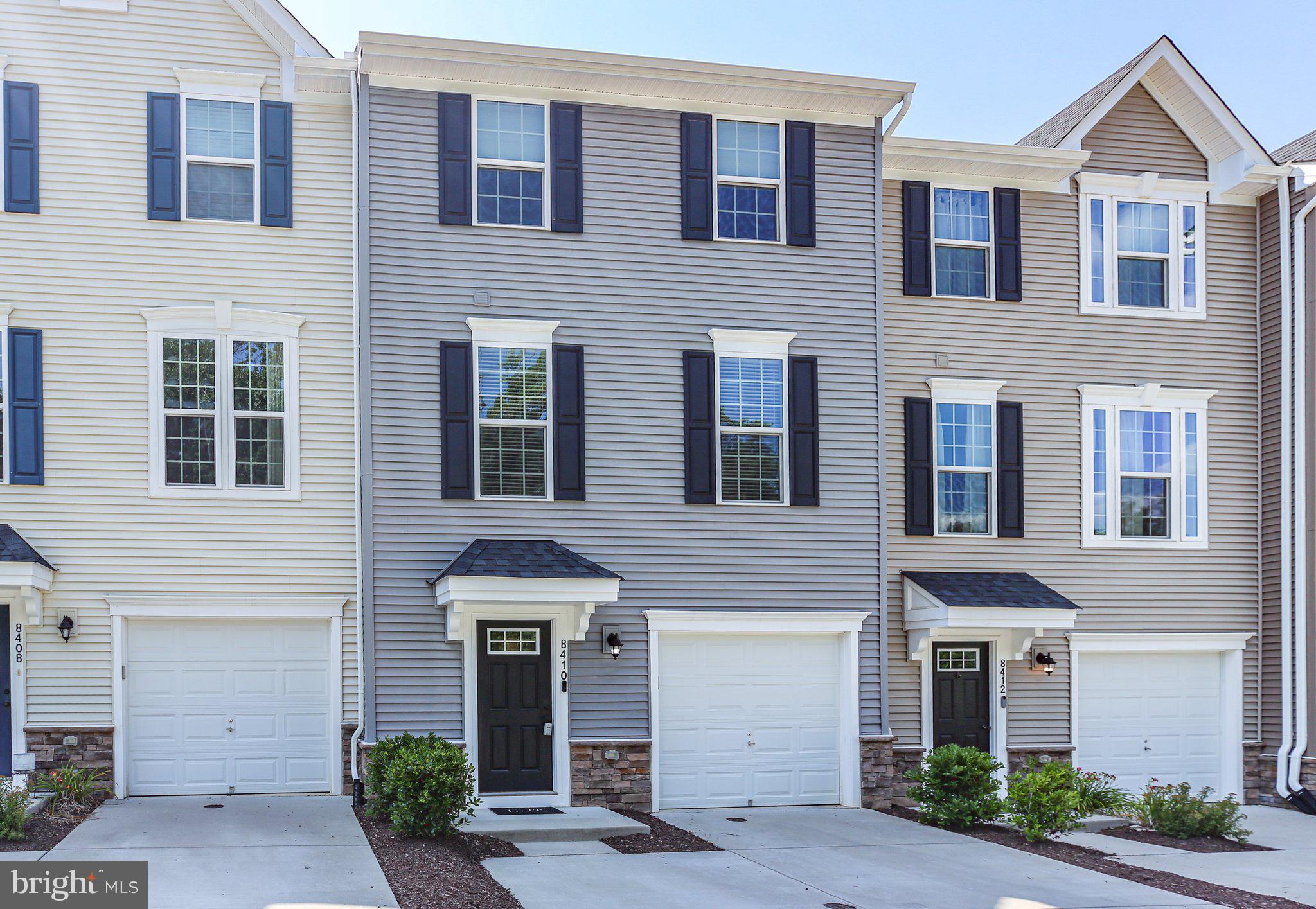 8410 Devries Lane Spotsylvania, VA 22553 - Photo 1 of 32 a front view of a house with yard and parking