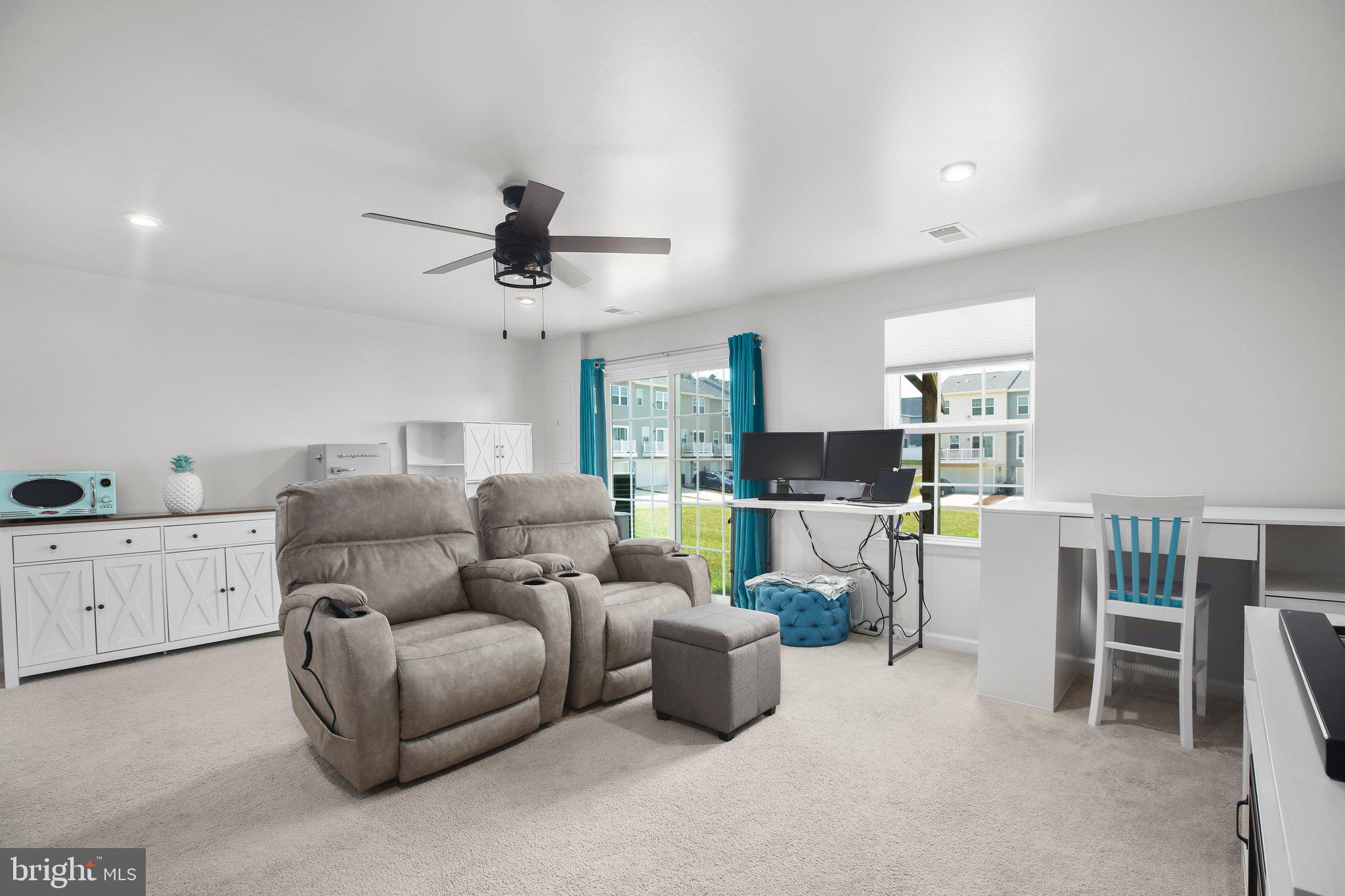 8410 Devries Lane Spotsylvania, VA 22553 - Photo 13 of 32 a living room with furniture and a ceiling fan