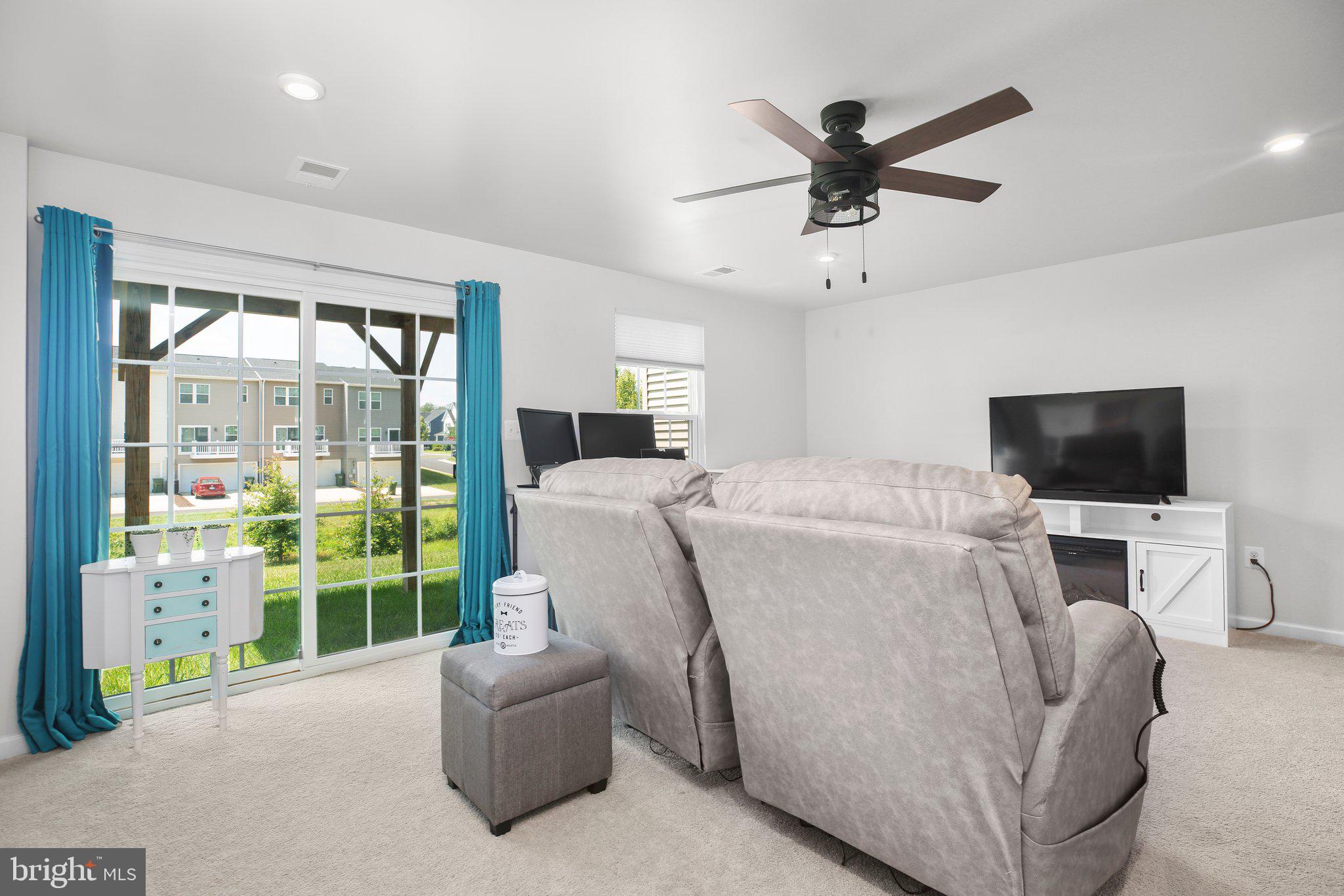 8410 Devries Lane Spotsylvania, VA 22553 - Photo 14 of 32 a living room with furniture and a flat screen tv