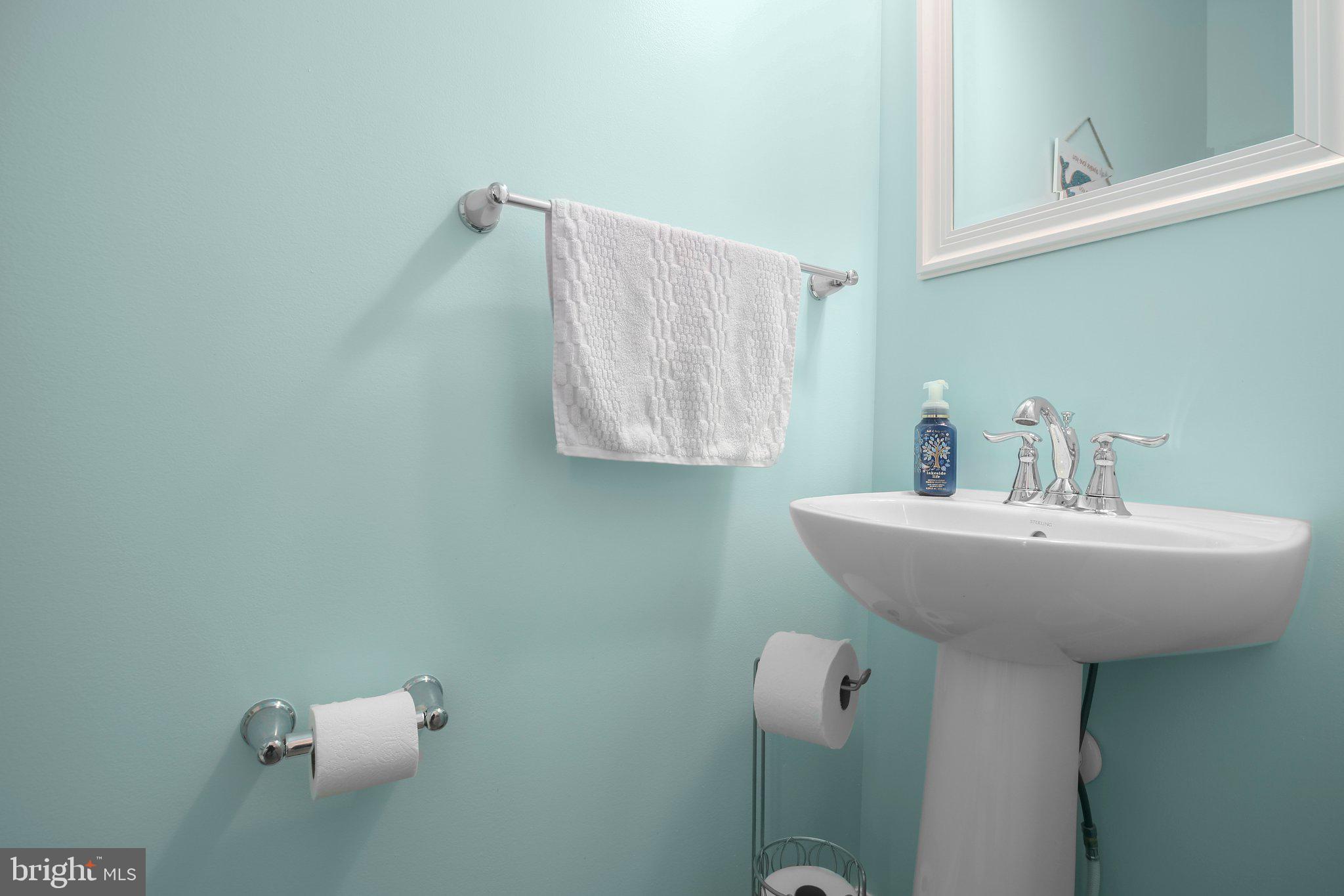8410 Devries Lane Spotsylvania, VA 22553 - Photo 21 of 32 a bathroom with a sink and mirror