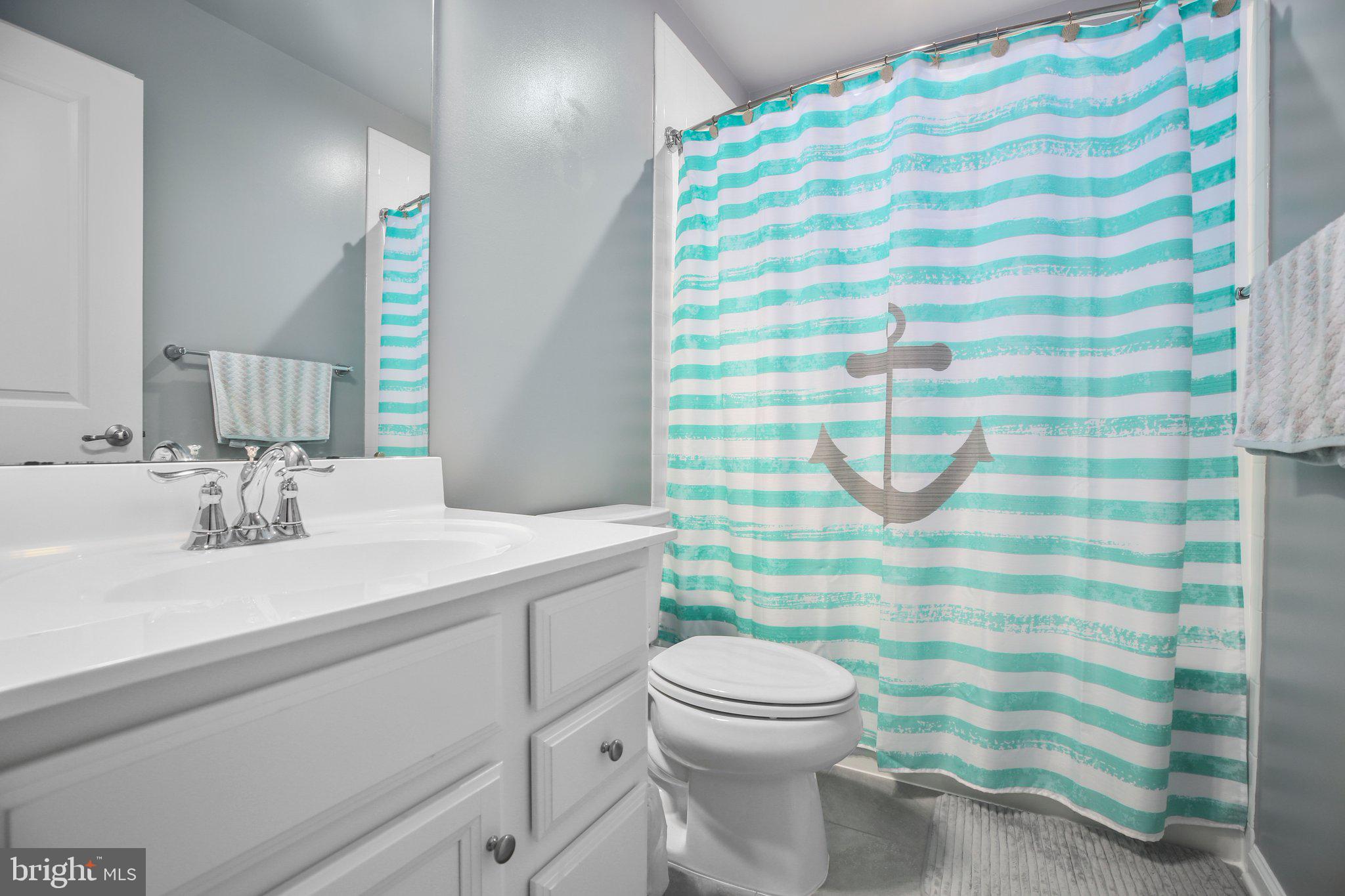 8410 Devries Lane Spotsylvania, VA 22553 - Photo 22 of 32 a bathroom with a sink toilet and shower