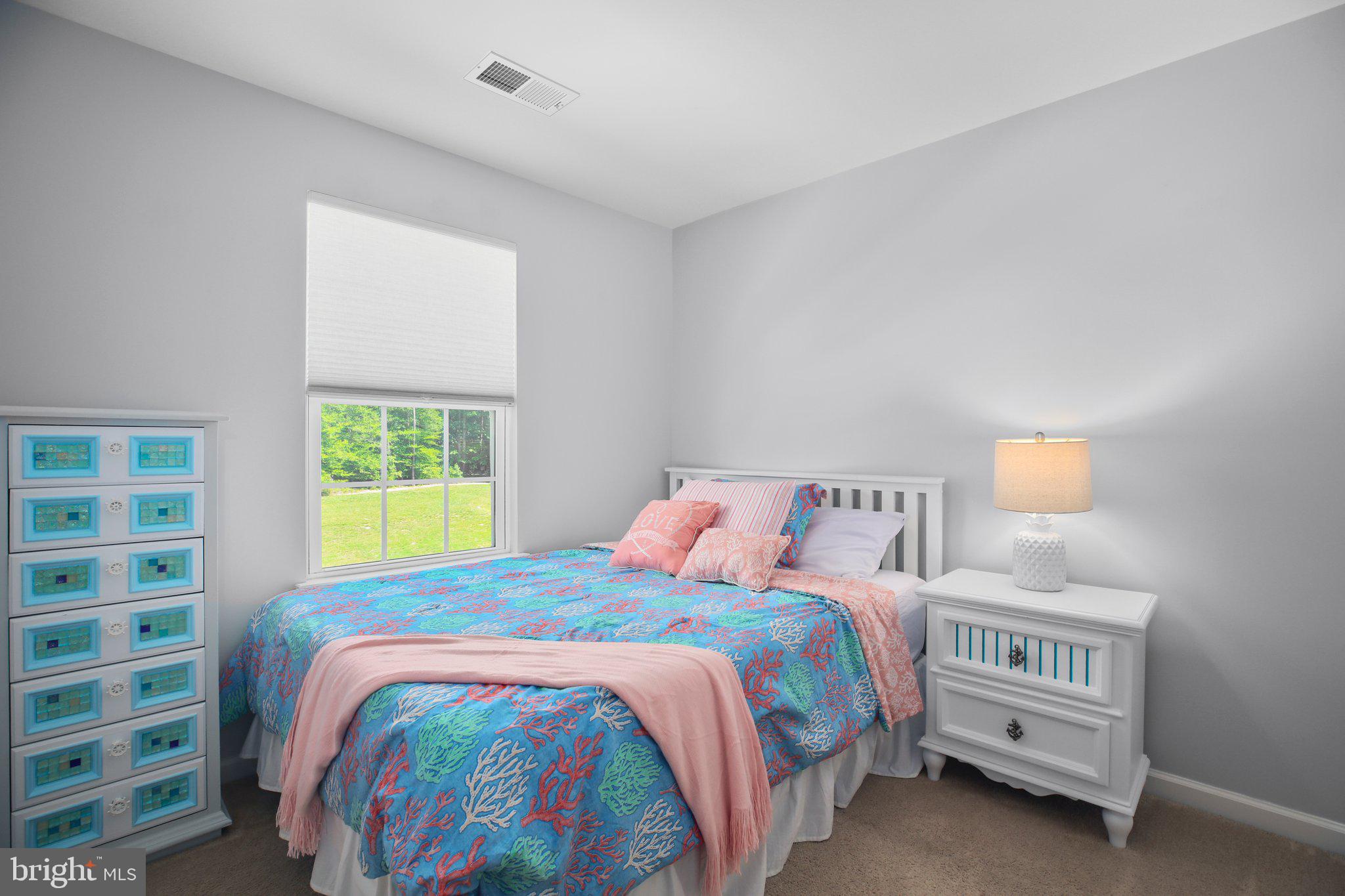 8410 Devries Lane Spotsylvania, VA 22553 - Photo 23 of 32 a bedroom with a bed and a window