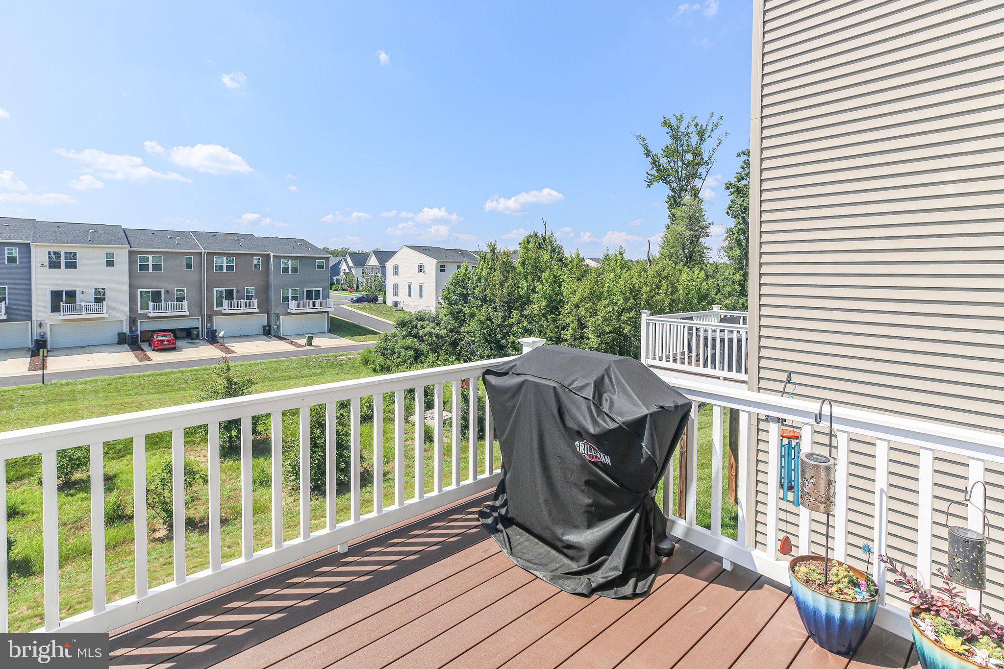 8410 Devries Lane Spotsylvania, VA 22553 - Photo 31 of 32 a view of a chairs and table on the deck