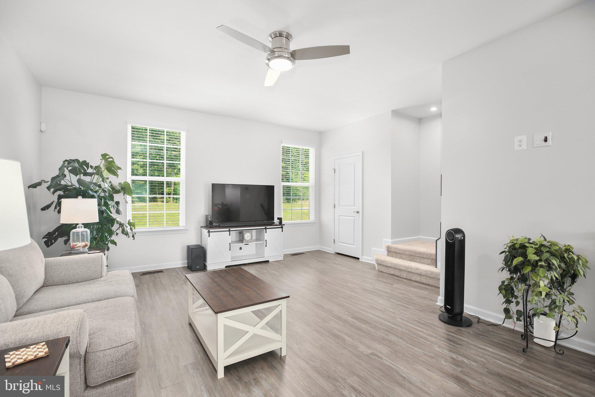 8410 Devries Lane Spotsylvania, VA 22553 - Photo 10 of 32 a living room with furniture and a flat screen tv