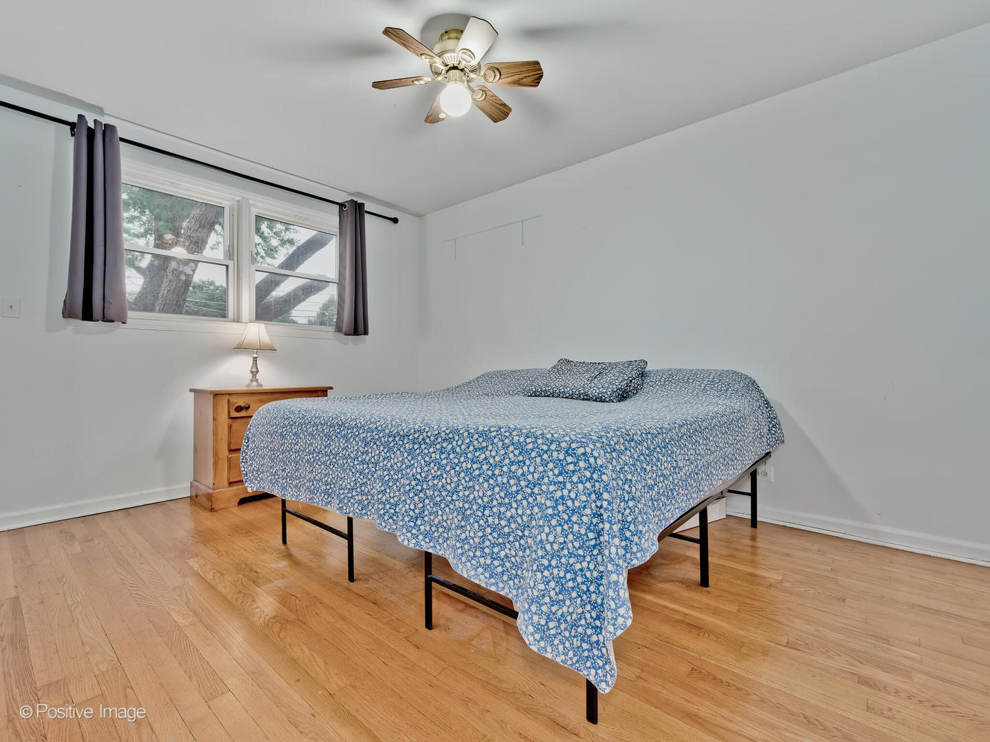 1910 Warren Street Evanston, IL 60202 - Photo 13 of 22 a bedroom with a bed and wooden floor