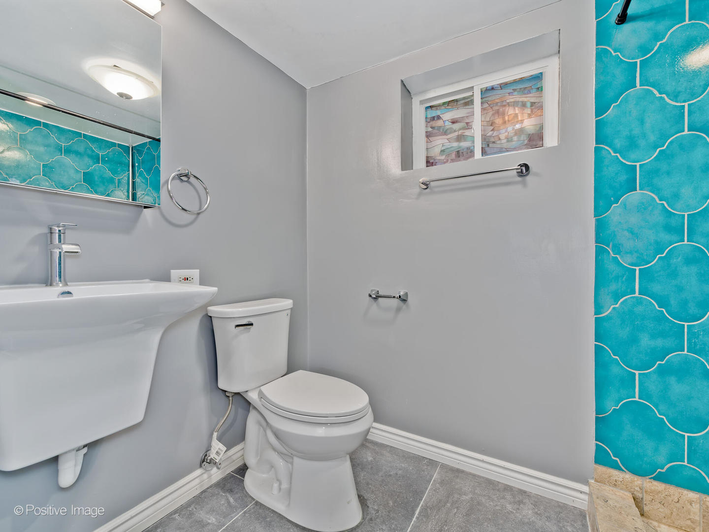 1910 Warren Street Evanston, IL 60202 - Photo 18 of 22 a bathroom with a toilet a sink and a mirror