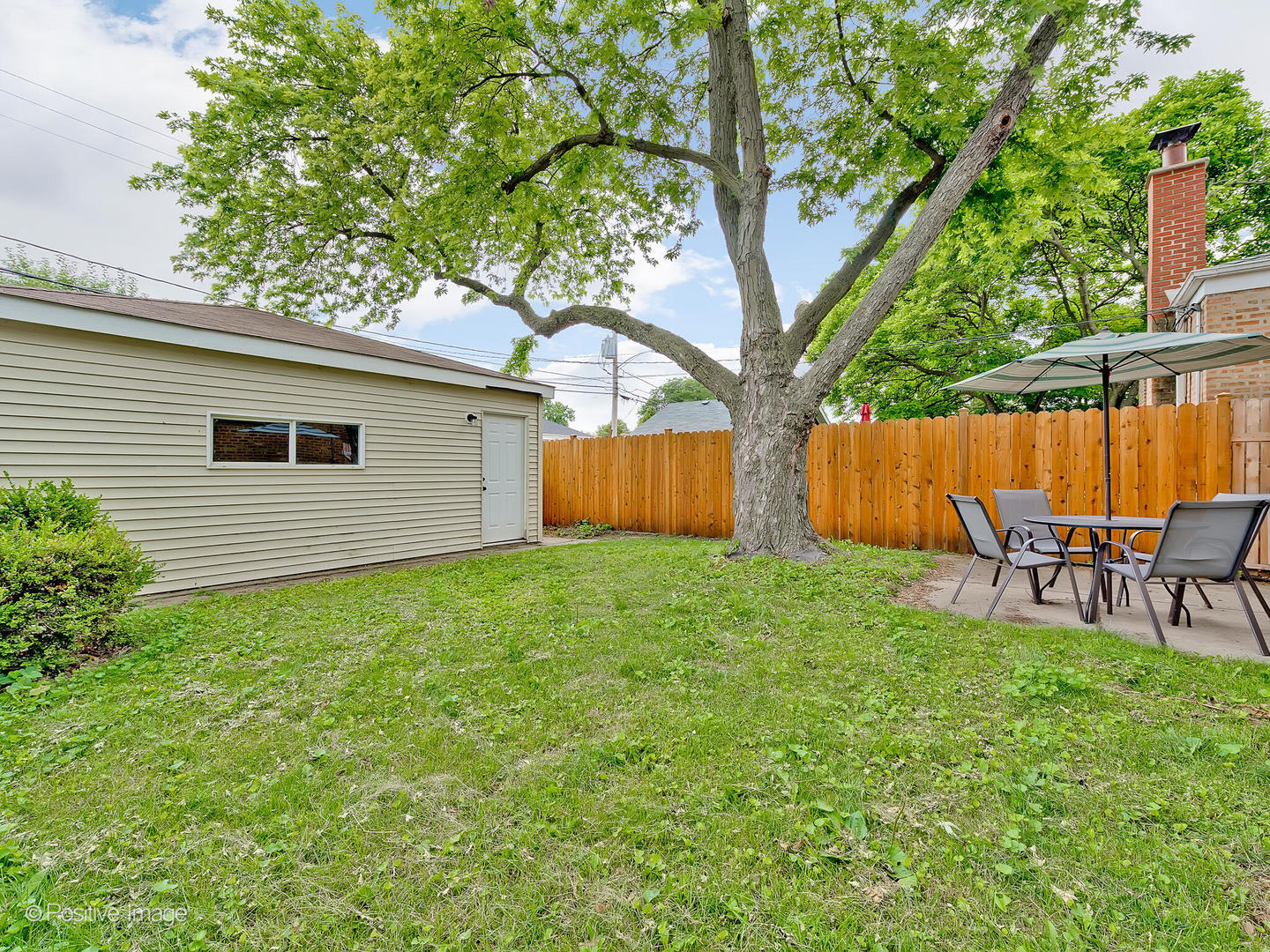 1910 Warren Street Evanston, IL 60202 - Photo 21 of 22 a backyard of a house with table and chairs