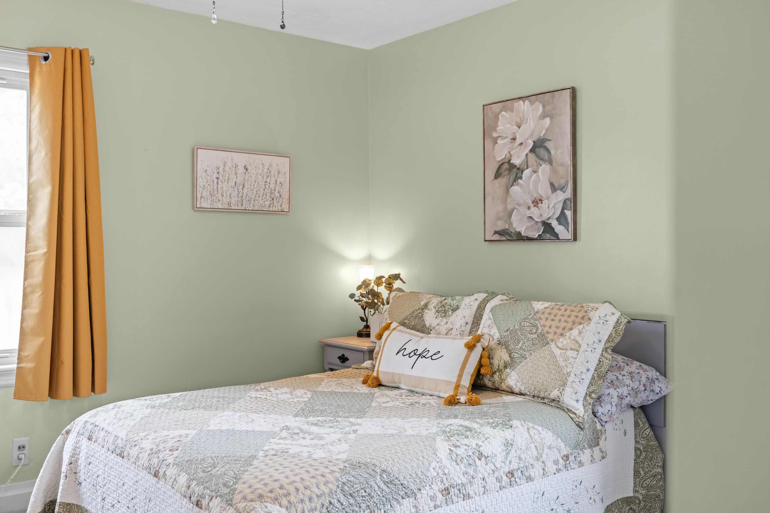 118 Stuart Avenue Stuarts Draft, VA 24477 - Photo 22 of 61 a bedroom with a bed and painting on the wall