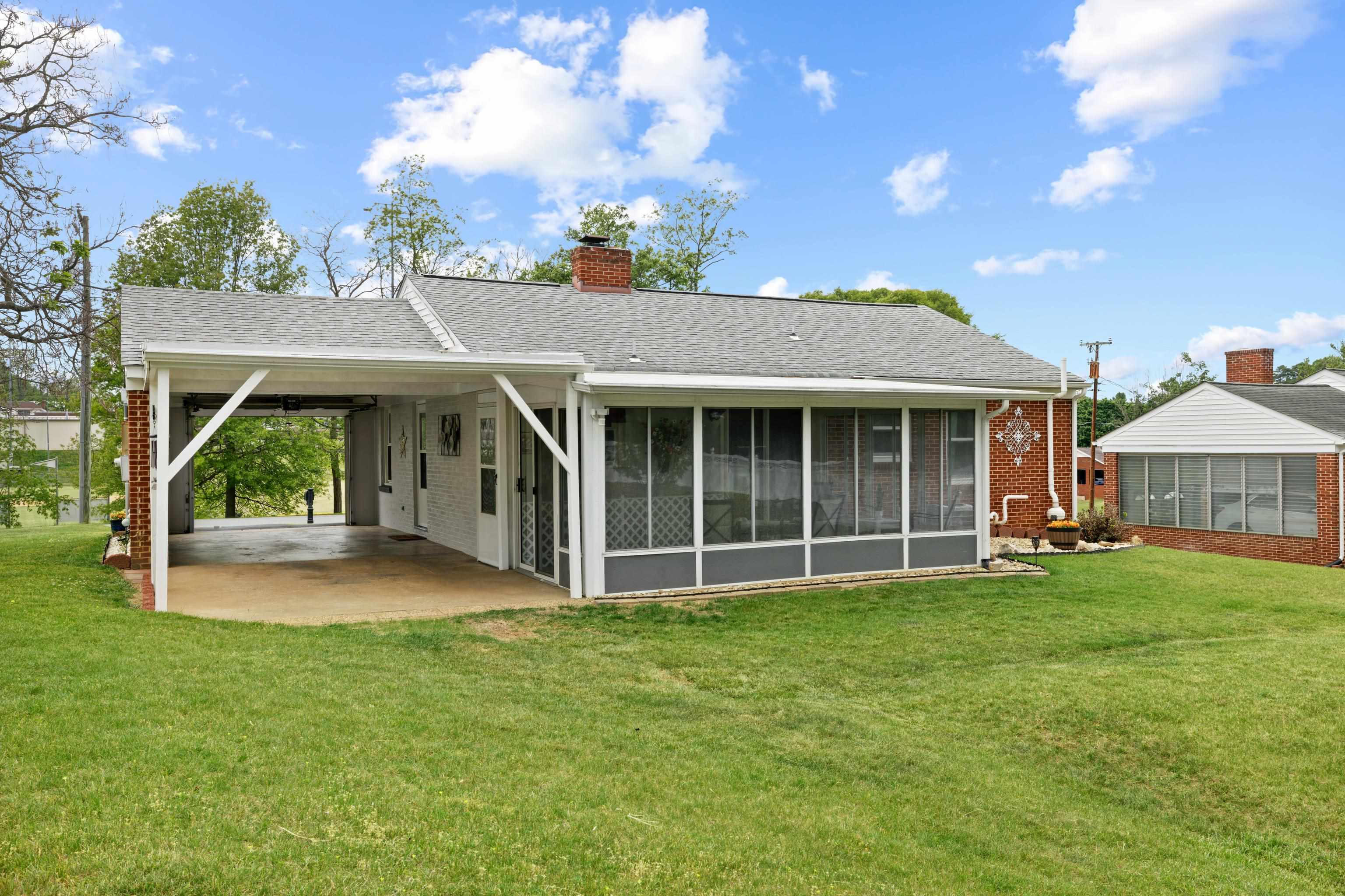 118 Stuart Avenue Stuarts Draft, VA 24477 - Photo 40 of 61 a view of a house with a yard and sitting area