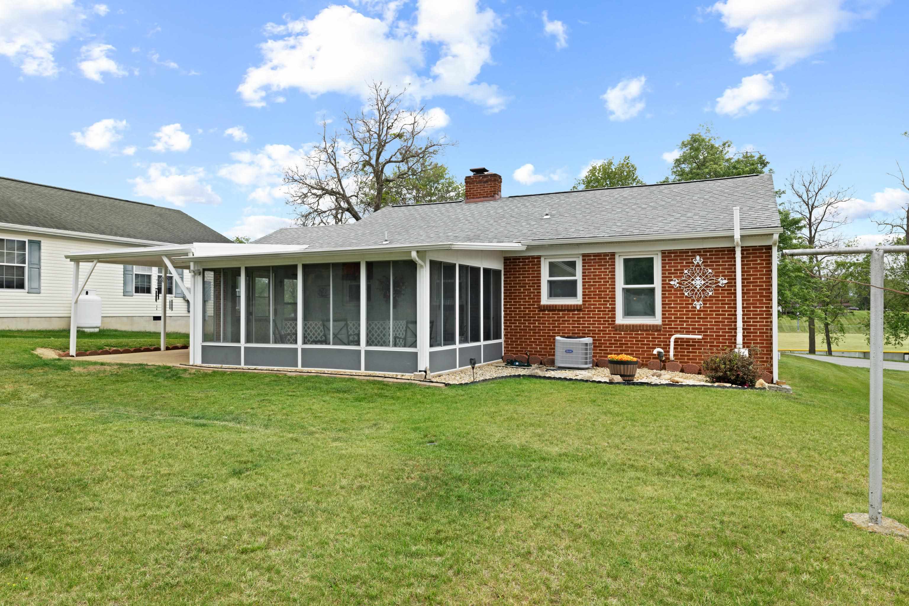 118 Stuart Avenue Stuarts Draft, VA 24477 - Photo 42 of 61 a view of a house with a backyard
