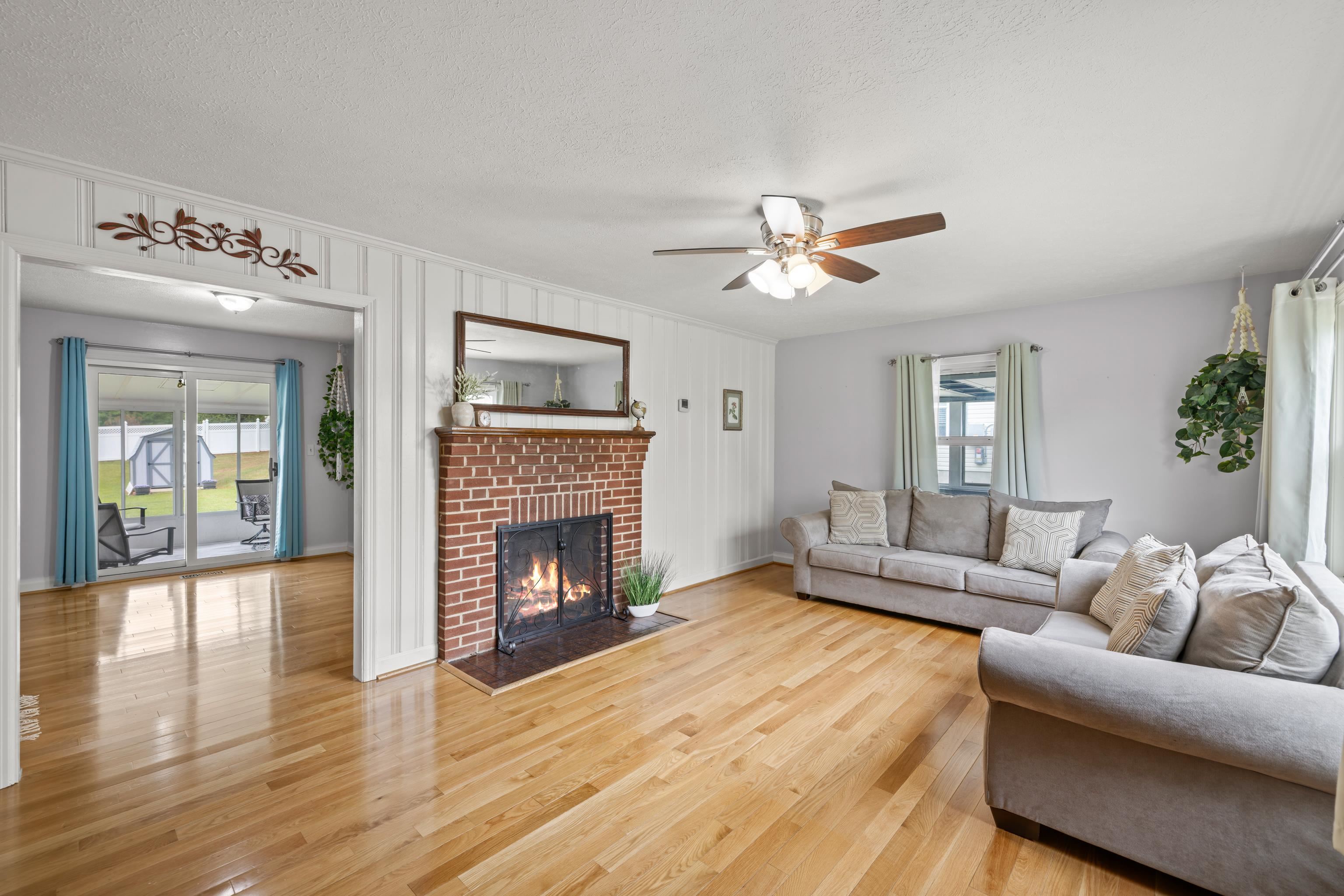 118 Stuart Avenue Stuarts Draft, VA 24477 - Photo 10 of 61 a living room with furniture and a fireplace