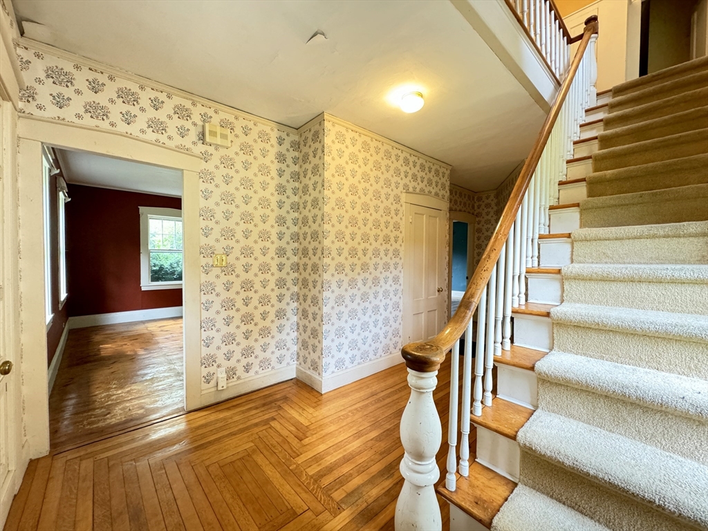 6 Pine Street Northfield, MA 01360 - Photo 14 of 42 a view of entryway with wooden floor and front door