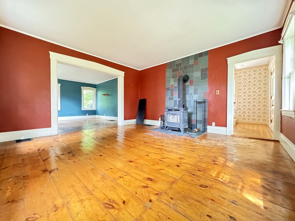 6 Pine Street Northfield, MA 01360 - Photo 15 of 42 a view of a livingroom with wooden floor and a chandelier