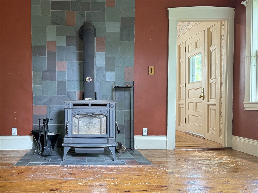 6 Pine Street Northfield, MA 01360 - Photo 16 of 42 a living room with furniture and a fireplace