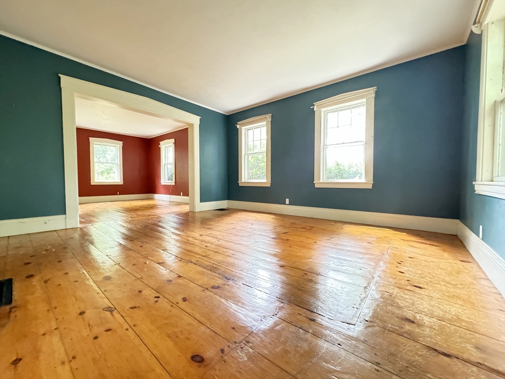 6 Pine Street Northfield, MA 01360 - Photo 17 of 42 a view of an empty room with window and wooden floor