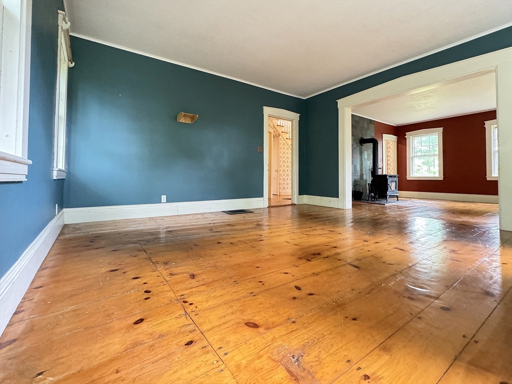 6 Pine Street Northfield, MA 01360 - Photo 18 of 42 a view of an empty room with window and wooden floor
