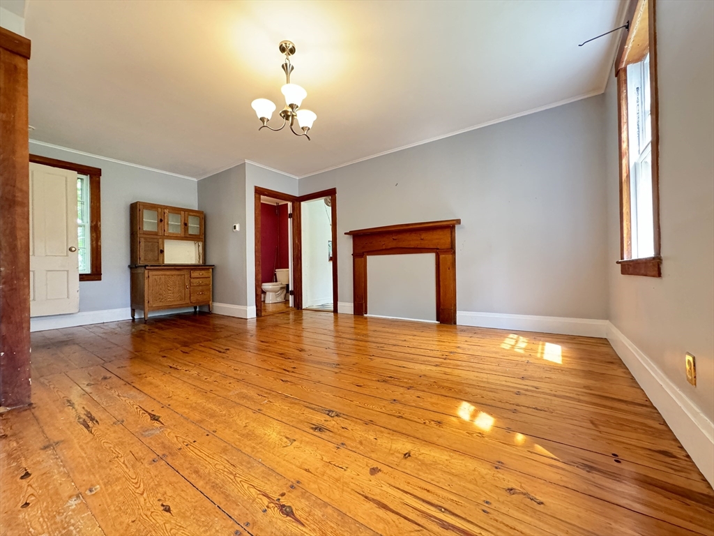 6 Pine Street Northfield, MA 01360 - Photo 20 of 42 a view of an empty room with window and wooden floor