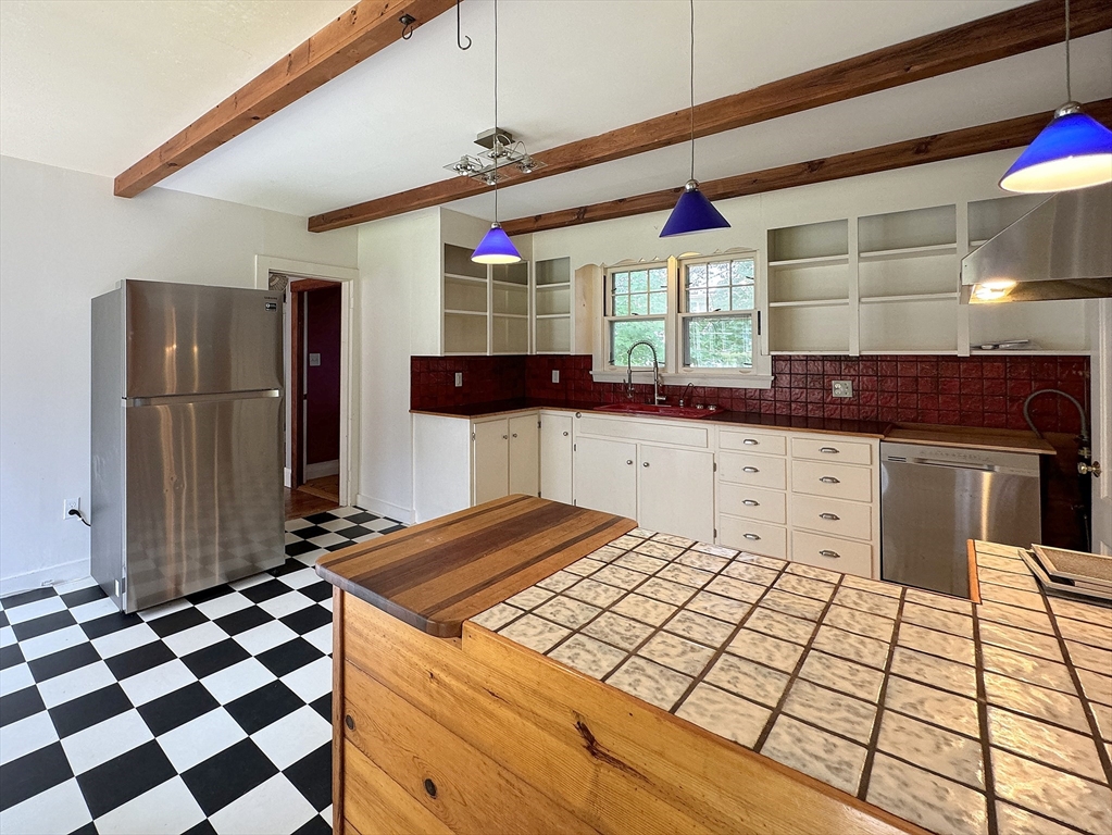 6 Pine Street Northfield, MA 01360 - Photo 26 of 42 a kitchen with a sink a refrigerator and cabinets