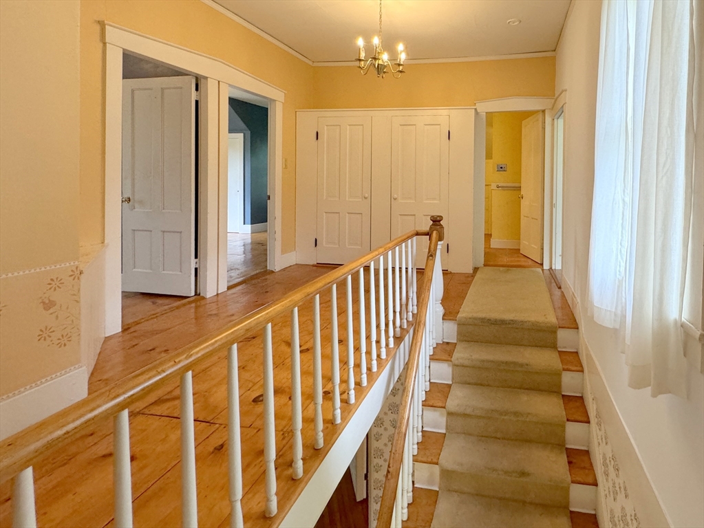 6 Pine Street Northfield, MA 01360 - Photo 30 of 42 a view of a hallway with wooden floor and entryway