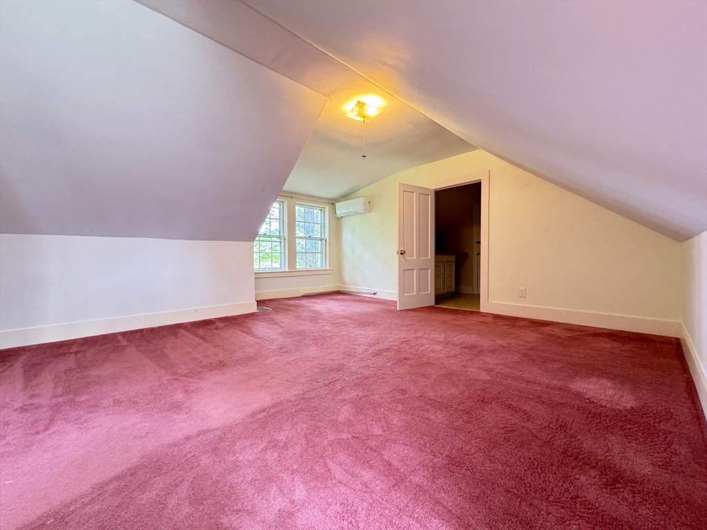 6 Pine Street Northfield, MA 01360 - Photo 37 of 42 a view of an empty room with wooden floor and windows