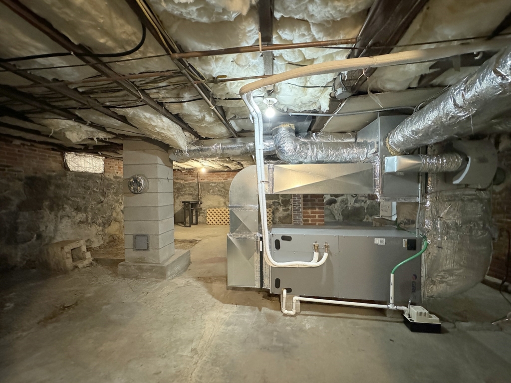 6 Pine Street Northfield, MA 01360 - Photo 40 of 42 a room with water heater and a wooden floors