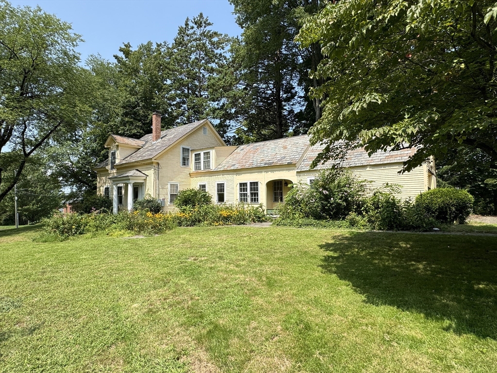 6 Pine Street Northfield, MA 01360 - Photo 5 of 42 a front view of a house with a yard