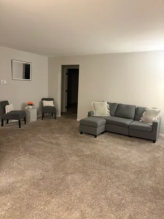 a living room with furniture and a couch