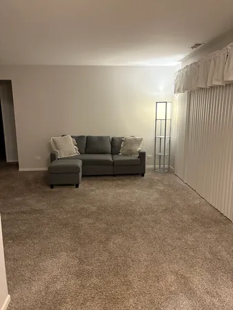a living room with furniture and a couch